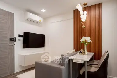 Modern living room with sleek furniture and stylish lighting in a contemporary apartment.