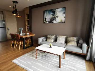 Modern living room with stylish decor and dining area