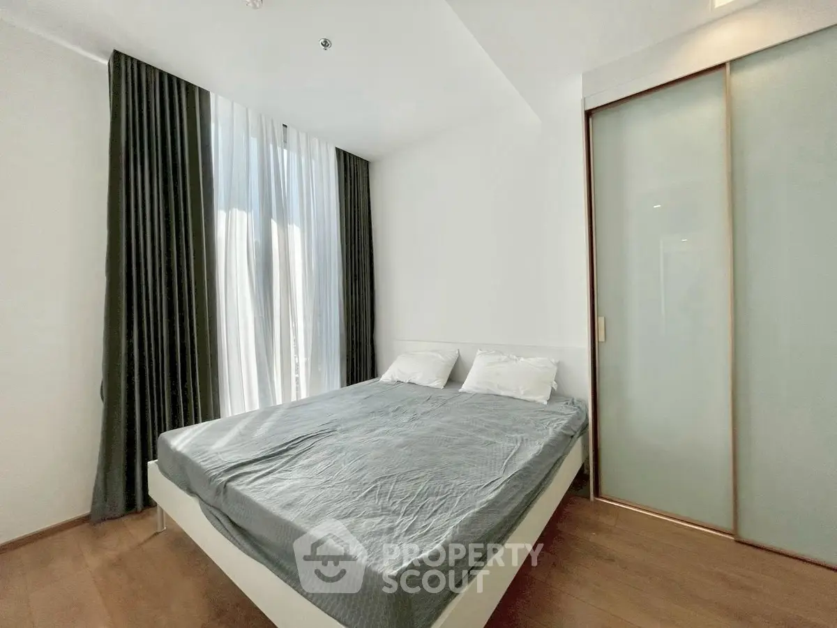 Modern bedroom with sleek design and ample natural light