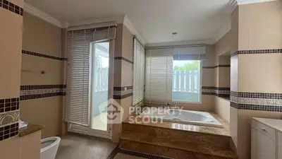 Luxurious bathroom with large bathtub and natural light