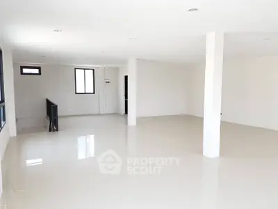 Spacious open-plan interior with modern design and ample natural light.