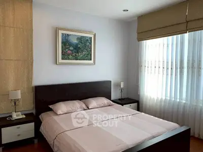 Cozy bedroom with elegant decor and natural light, featuring a comfortable bed and stylish furnishings.