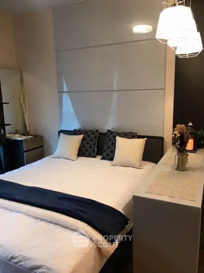 Cozy modern bedroom with stylish lighting and elegant decor