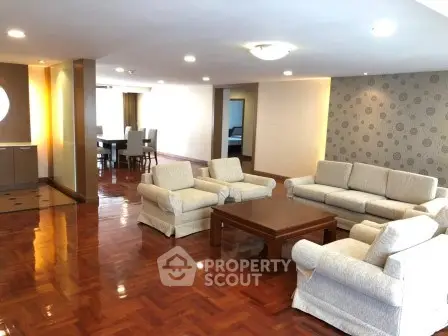 Spacious living room with elegant furniture and polished wooden floors