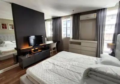 Spacious modern bedroom with natural light and stylish decor