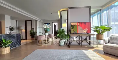 Luxurious modern living room with elegant decor and abundant natural light