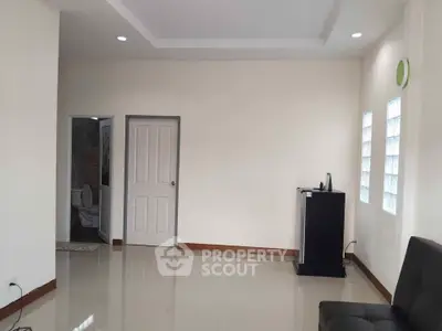 Spacious living room with modern design and glossy tiled flooring