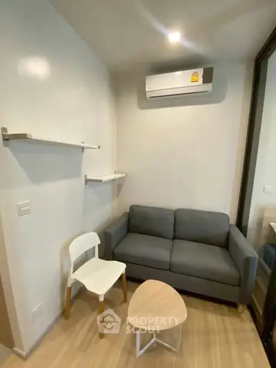 Cozy modern living room with air conditioning and minimalist furniture