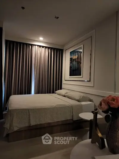 Cozy bedroom with elegant decor and soft lighting, perfect for relaxation.