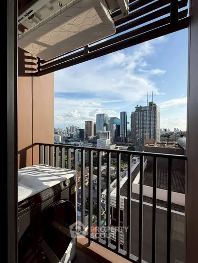Stunning high-rise balcony view with city skyline and modern laundry setup.