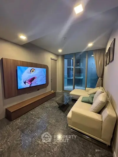 Modern living room with sleek marble flooring and stylish furniture in a contemporary apartment.