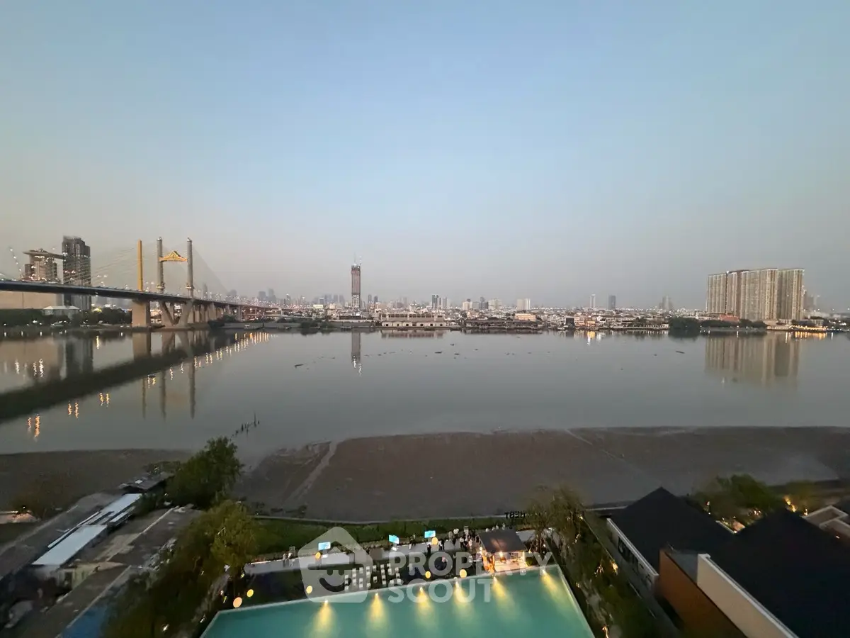 Stunning river view from high-rise apartment with city skyline and bridge