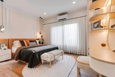 Luxurious bedroom with modern decor and ample natural light