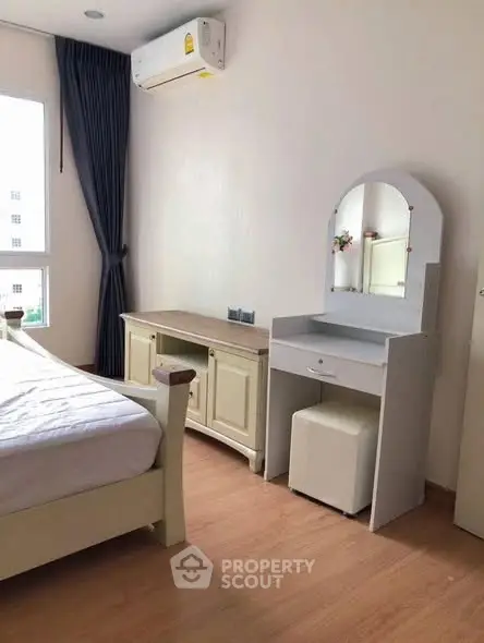 Cozy bedroom with elegant vanity and natural light