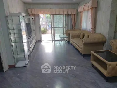 Spacious living room with elegant furniture and large windows for natural light