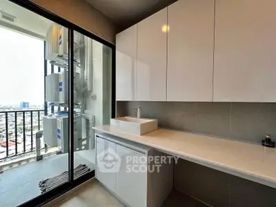 Modern laundry room with city view and sleek cabinetry