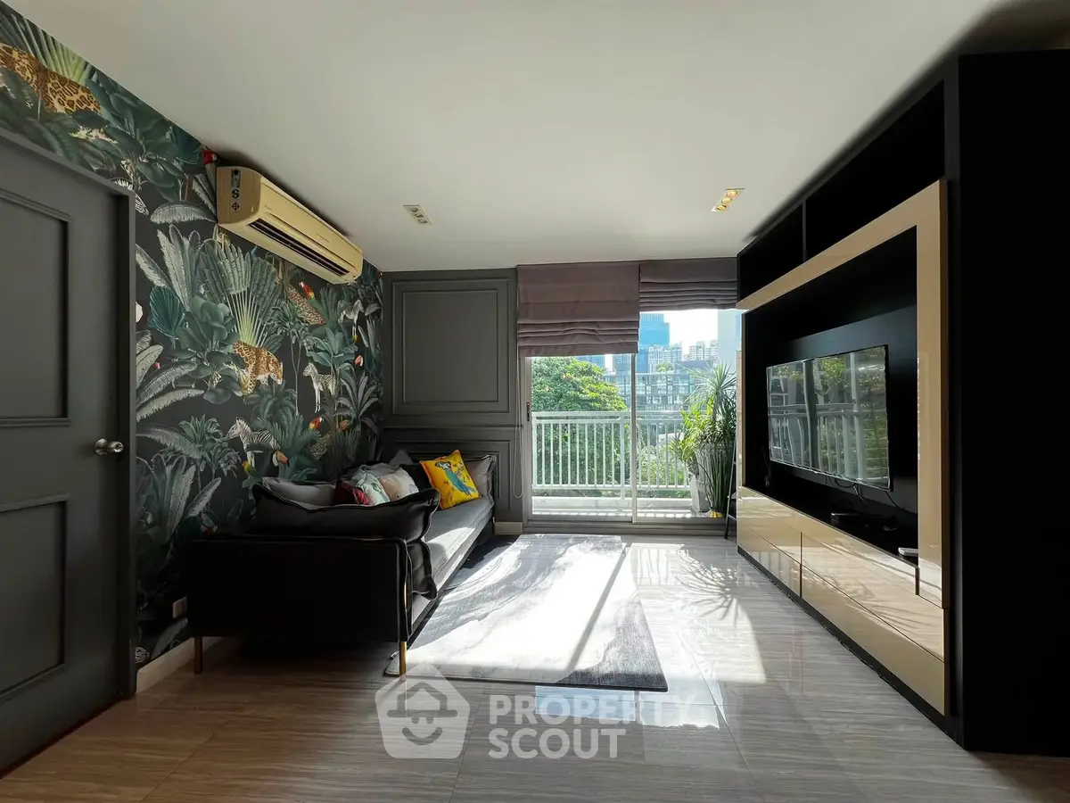 Stylish living room with modern decor and balcony view in urban apartment.