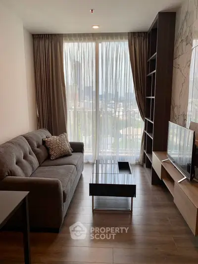 Modern living room with stylish sofa and large window view