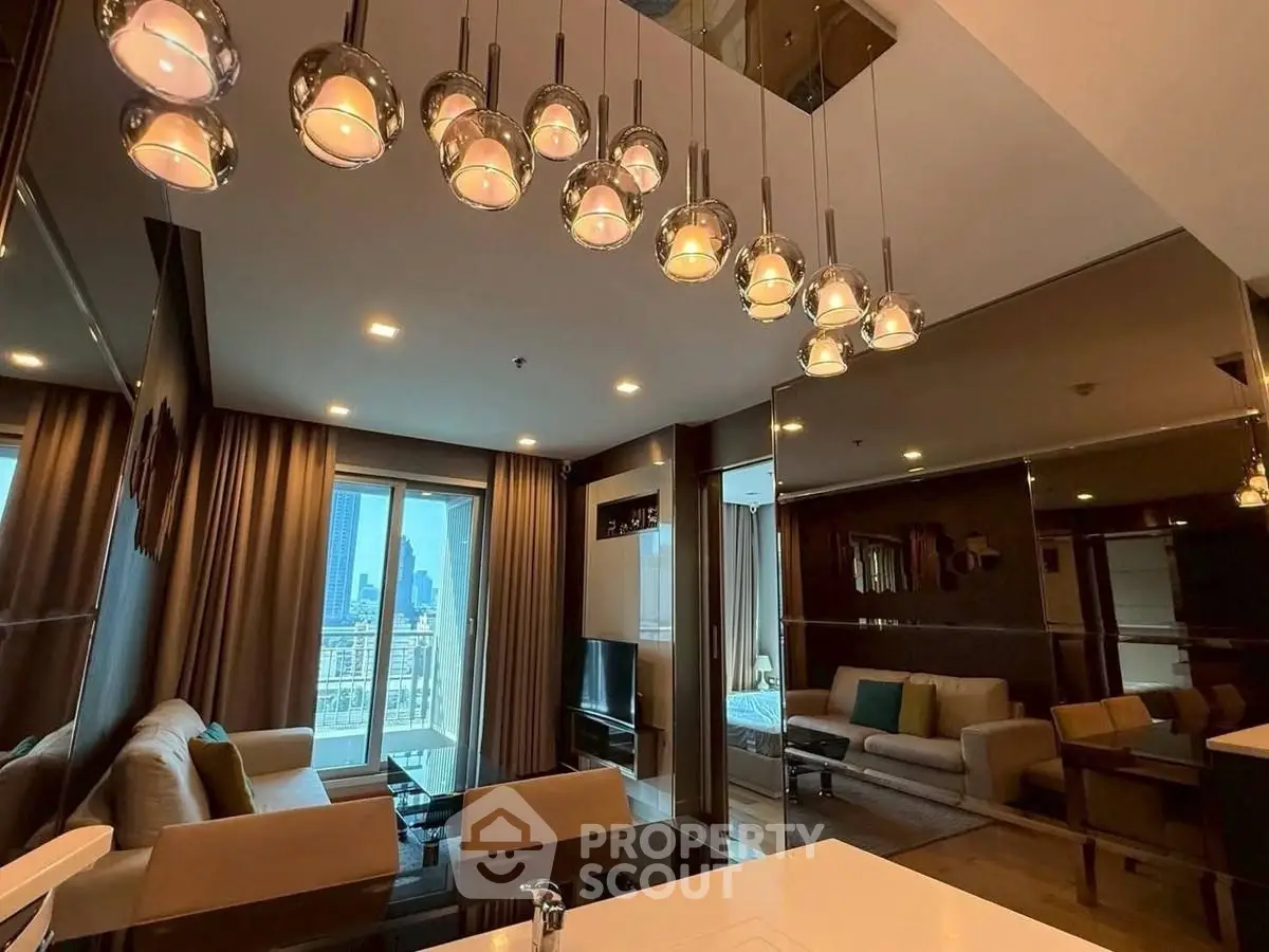 Modern living room with elegant lighting and city view from balcony