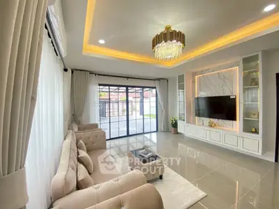 Luxurious living room with elegant chandelier and modern decor