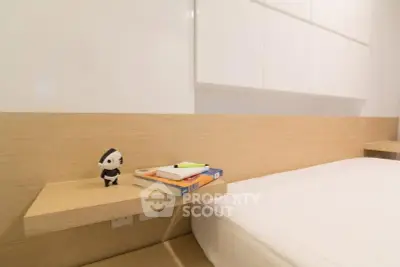 Modern minimalist bedroom with built-in shelves and cozy bed