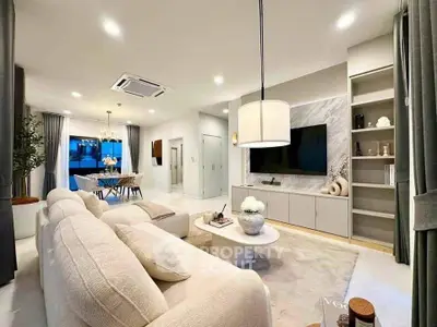 Luxurious modern living room with elegant decor and spacious dining area, perfect for entertaining.