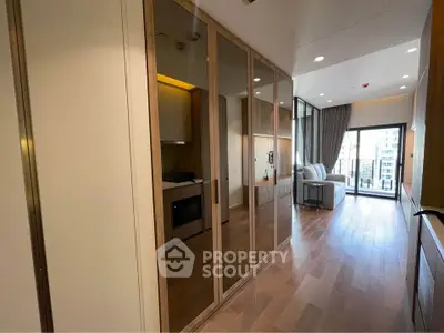 Modern apartment interior with wooden flooring and large windows