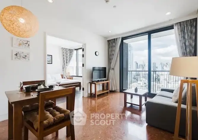 Spacious living room with city view and modern decor in high-rise apartment
