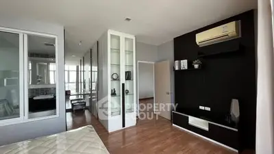 Modern bedroom with sleek design and air conditioning unit