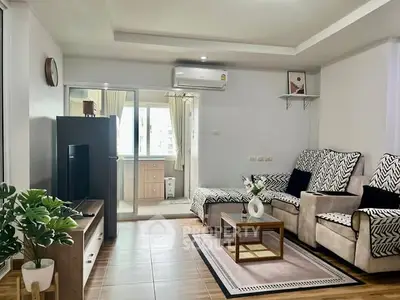 Spacious living room with modern decor and natural light