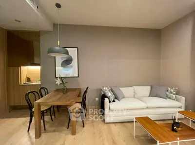 Modern living room with cozy sofa and elegant dining area