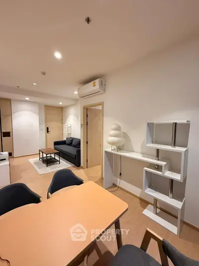 Modern living room with stylish furniture and open layout in a contemporary apartment.