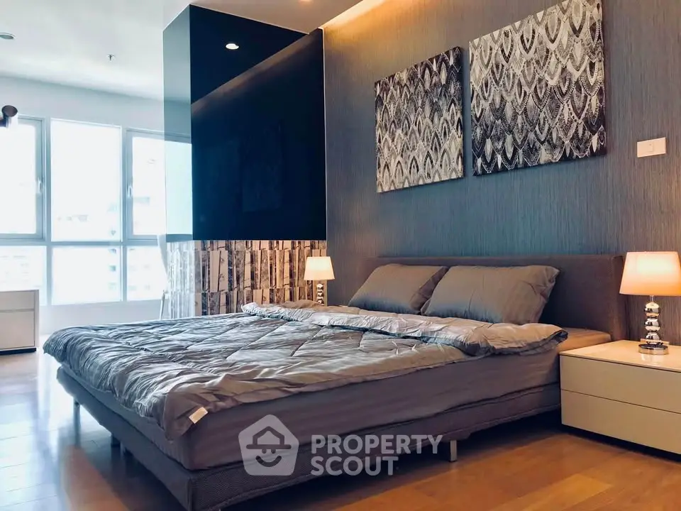 Luxurious modern bedroom with stylish decor and ample natural light
