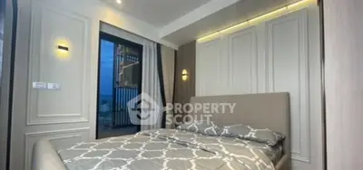 Luxurious bedroom with elegant decor and city view from the window.