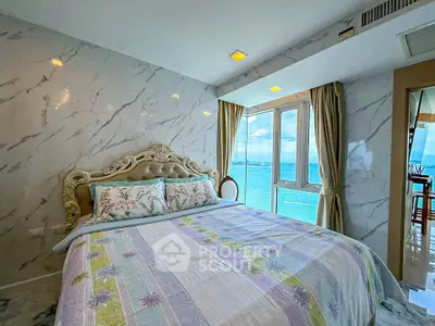 Luxurious bedroom with stunning ocean view and elegant decor