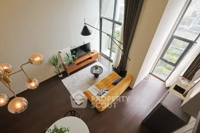 Stunning modern living room with high ceilings and large windows offering a breathtaking city view.