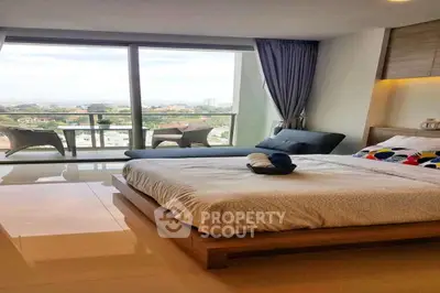 Luxurious bedroom with stunning city view and spacious balcony access