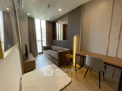 Modern living room with stylish decor and city view, featuring a cozy sofa and elegant dining area.