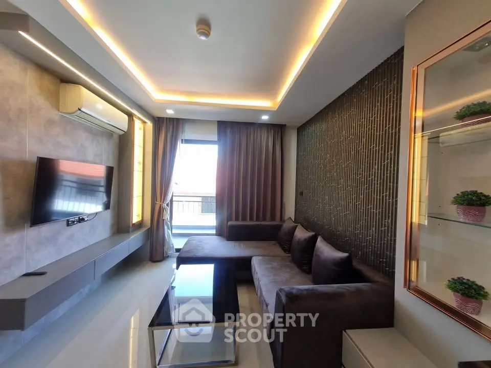 Modern living room with sleek design, large sofa, and stylish lighting