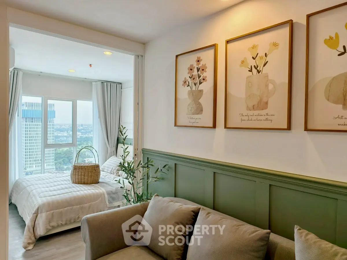 Charming living room with cozy sofa and elegant bedroom view, perfect for modern living.