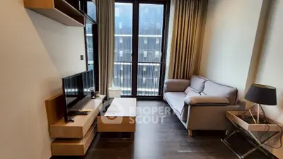 Modern living room with sleek furniture and large window view