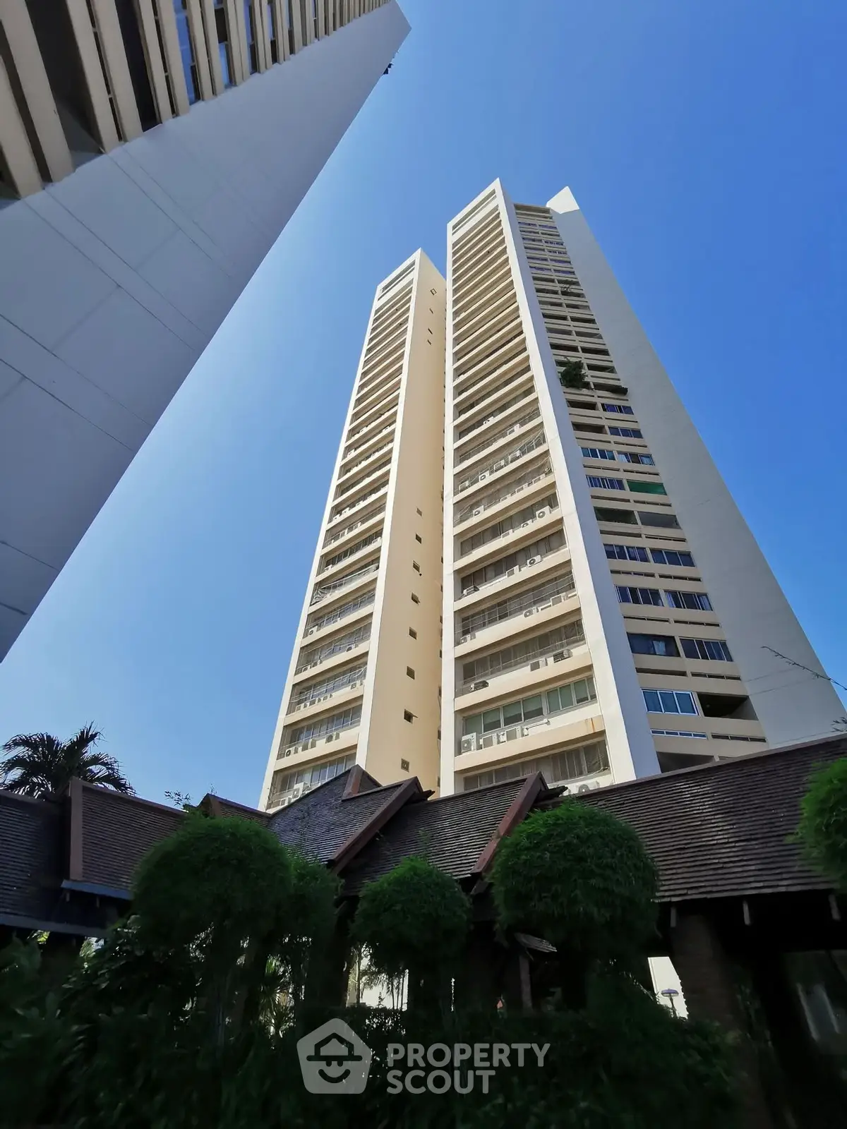 Stunning high-rise building with modern architecture against a clear blue sky.