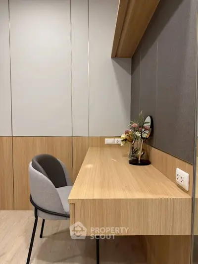 Modern study area with sleek wooden desk and comfortable chair