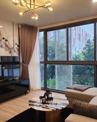 Modern living room with large windows and stylish decor