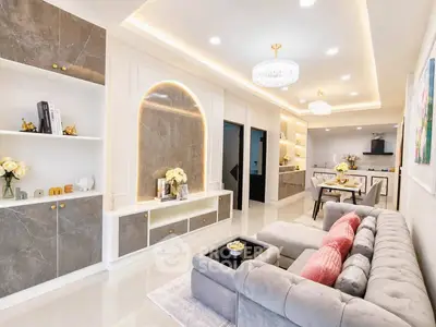 Luxurious modern living room with elegant decor and open kitchen layout
