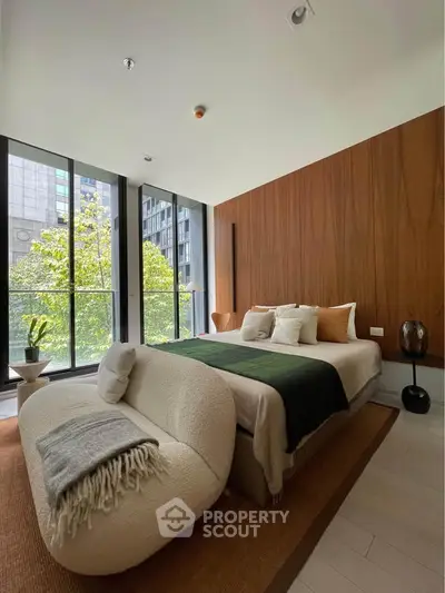 Luxurious modern bedroom with large windows and stylish decor