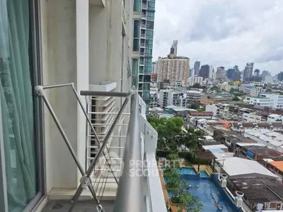 Stunning city view from modern apartment balcony with urban skyline.