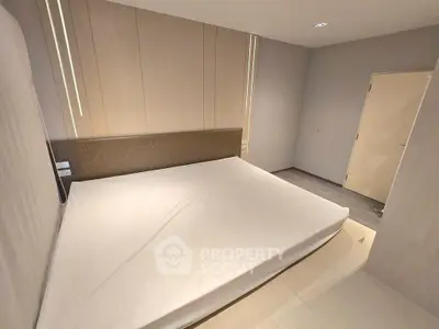 Modern minimalist bedroom with sleek design and neutral tones