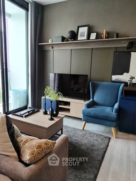 Stylish modern living room with elegant decor and balcony access, perfect for urban living.