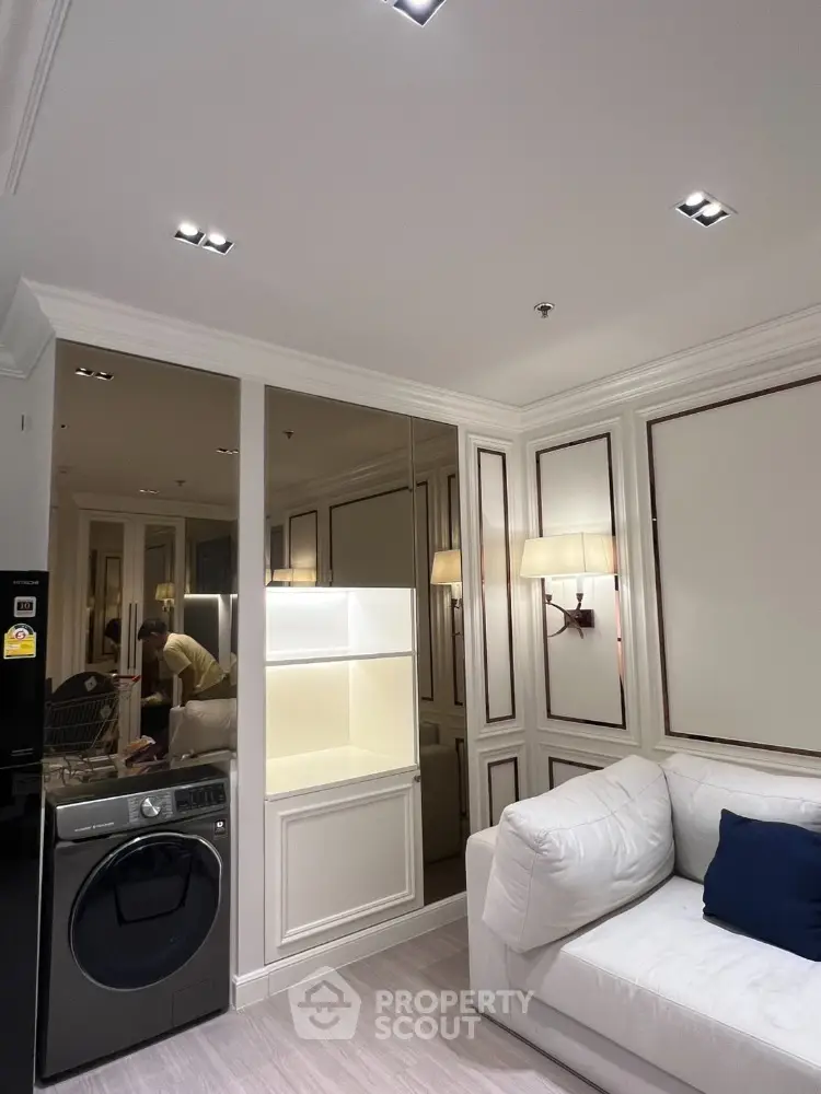 Luxurious living room with modern washing machine and elegant lighting